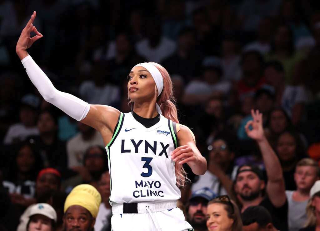 Minnesota Lynx player DiJonai Carrington celebrates a three-point shot during a 2025 WNBA game.