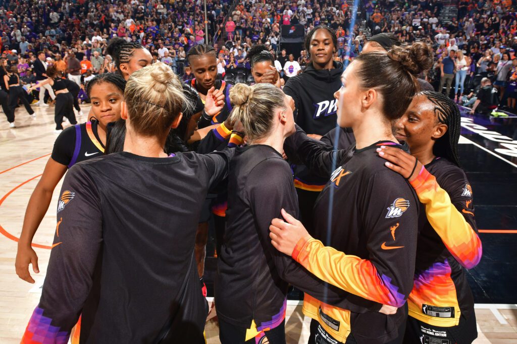 The Phoenix Mercury huddles before a 2025 WNBA game.