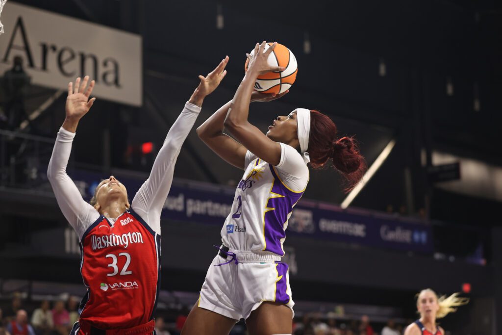 LA Sparks forward Rickea Jackson shoots the ball over Washington Mystics forward Alysha Clark during a 2025 WNBA game.