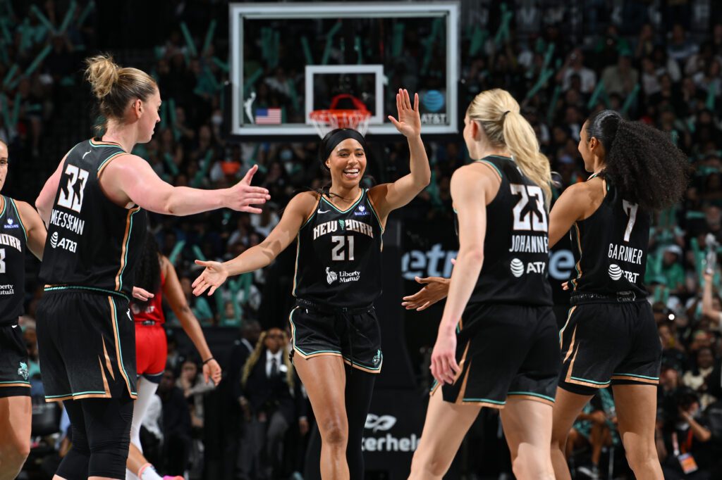 New York Liberty forward Isabelle Harrison celebrates a play with her teammates during a 2025 WNBA game.