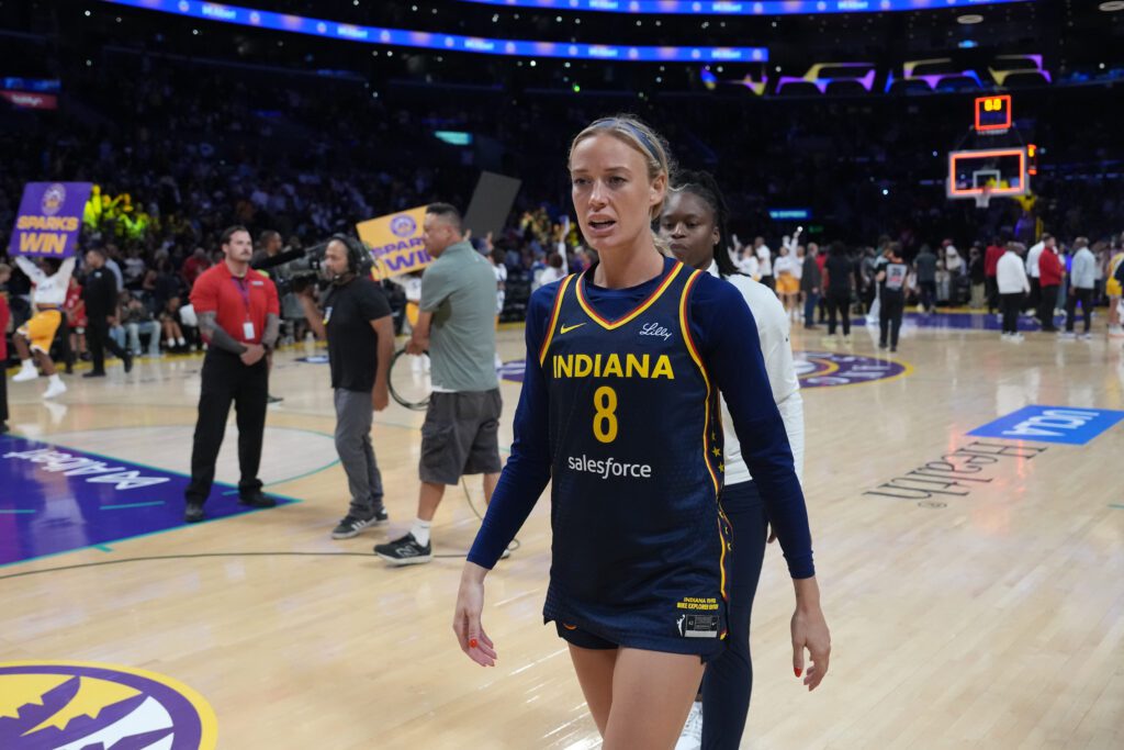 Indiana Fever guard Sophie Cunningham walks off the court after a 2025 WNBA game.