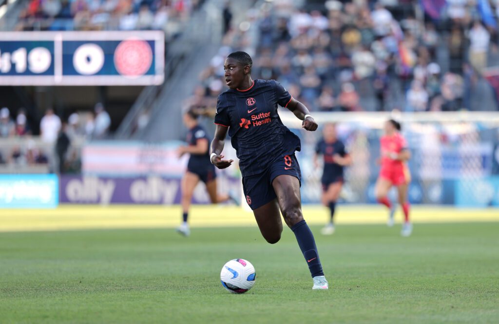 Bay FC forward Asisat Oshoala dribbles the ball down the pitch during a 2025 NWSL match.