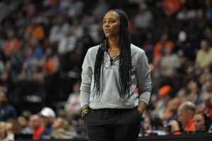 Seattle Storm head coach Noelle Quinn looks on from the sideline during a 2025 WNBA game.