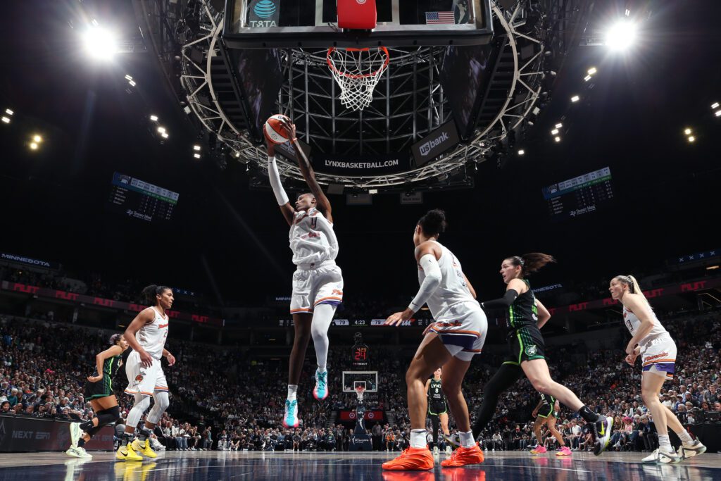 Phoenix Mercury center Natasha Mack leaps for a rebound during Game 2 of the 2025 WNBA semifinals.