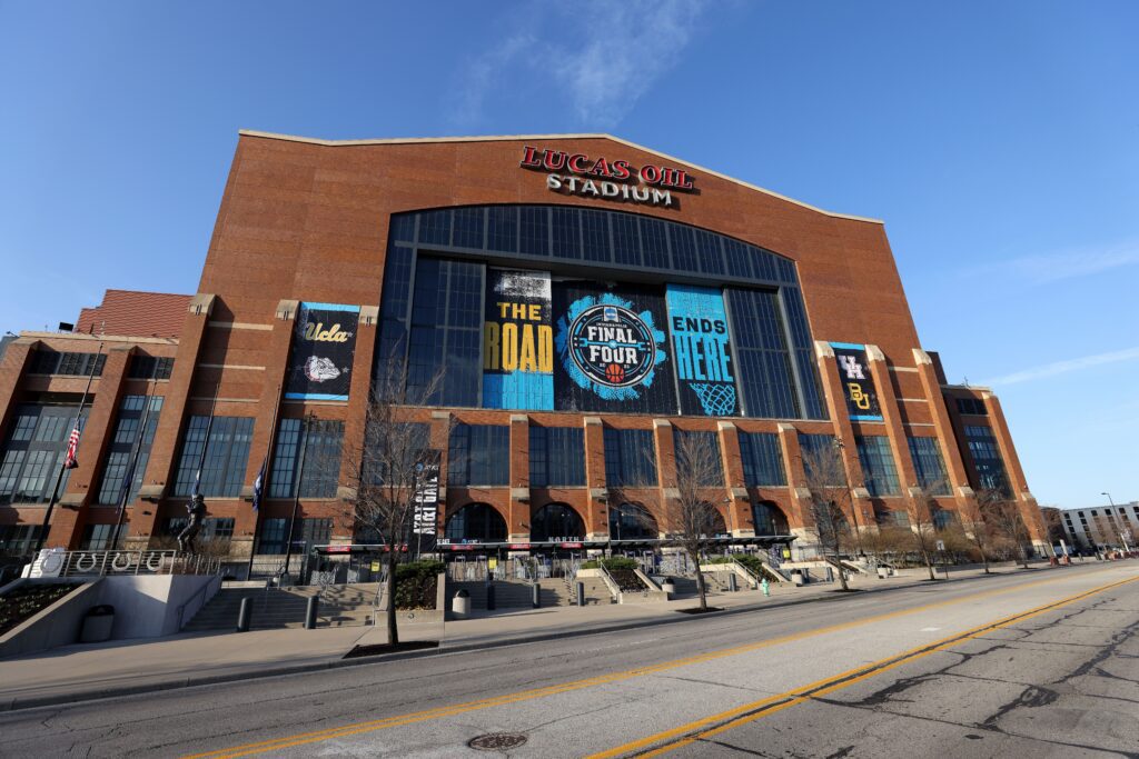 An exterior view of Indianapolis's Lucas Oil Stadium with signage for the 2021 NCAA Men's Basketball Final Four.