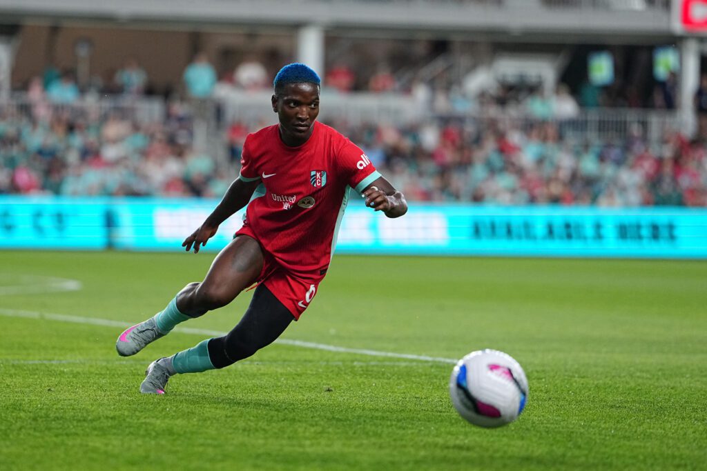 Kansas City Current striker and Malawi international Temwa Chawinga controls the ball during a 2025 NWSL match.