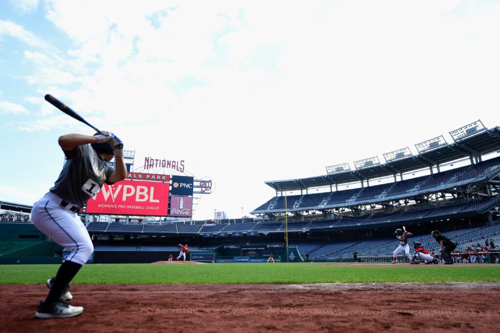 A batter watches a pitch on deck during the first-ever WPBL try-outs at MLB's Nationals Park.