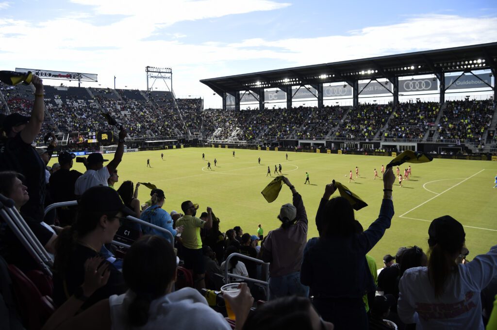 Fans cheer on Croix Bethune and the Washington Spirit at Audi Field during a 2025 NWSL match.
