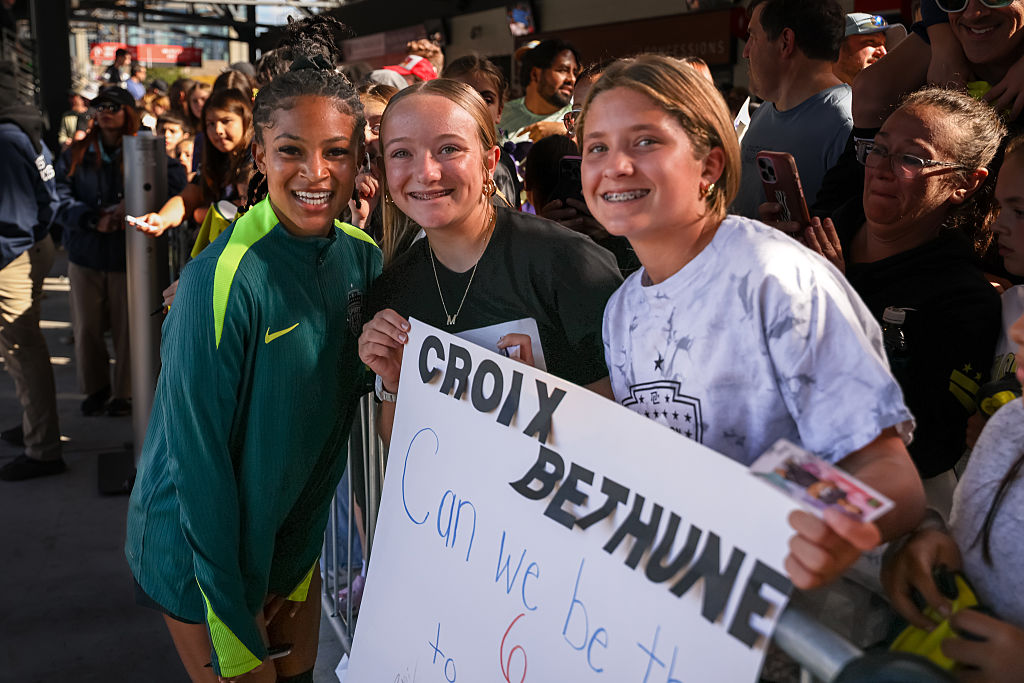Croix Bethune #7 of the Washington Spirit interacts with fans after the NWSL game against the Orlando Pride at Audi Field on October 18, 2025 in Washington, DC.