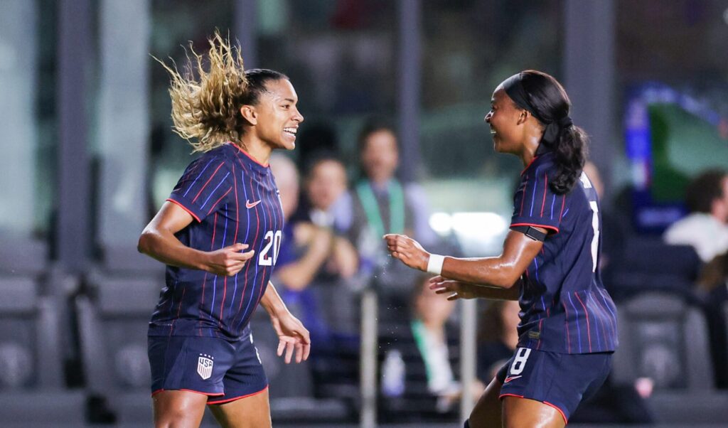 USWNT striker Catarina Macario celebrates her goal with forward Jaedyn Shaw during the team's final friendly of 2025.