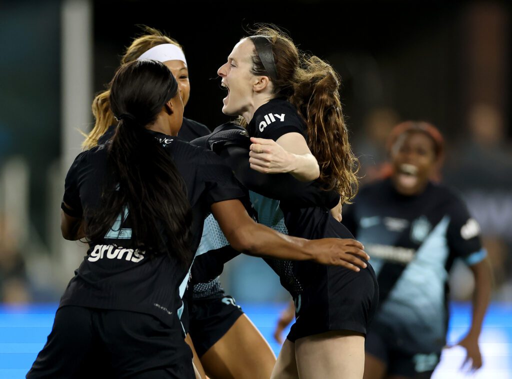 Gotham FC star Rose Lavelle celebrates her title-winning goal with teammates Midge Purce and Jaedyn Shaw during the 2025 NWSL Championship match.
