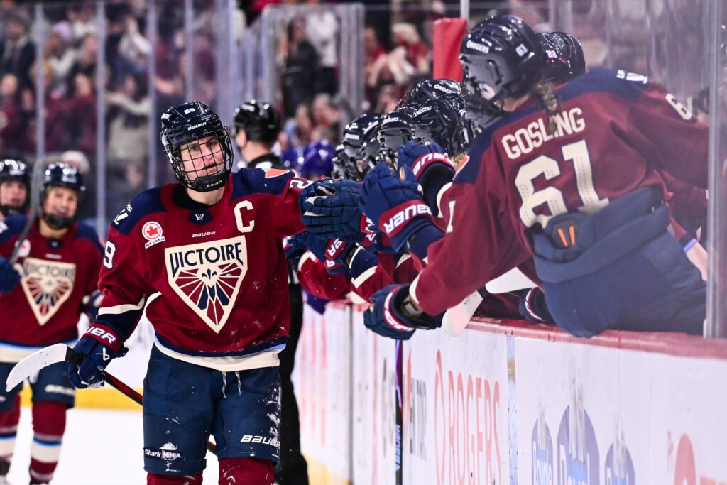 Montréal star Marie-Philip Poulin celebrates her goal with the Victoire bench during a 2025/26 PWHL game.