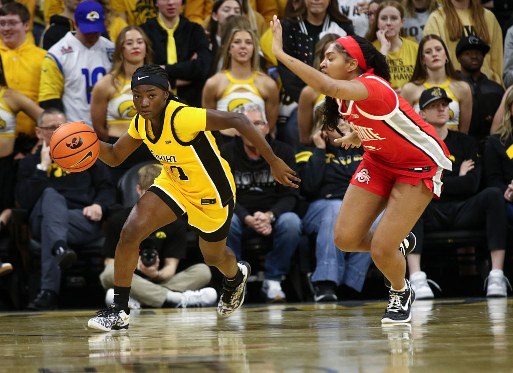 Guard Chazadi "Chit-Chat" Wright #11 of the Iowa Hawkeyes goes down the court in the second half of Iowa vs Ohio State against guard Chance Gray #2 of the Ohio State Buckeyes on January 25, 2026 at Carver-Hawkeye Arena, in Iowa City, Iowa. (Photo by