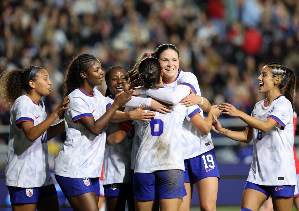USWNT attacker Emma Sears hugs goalscorer Emily Sams during a 2026 friendly against Chile.