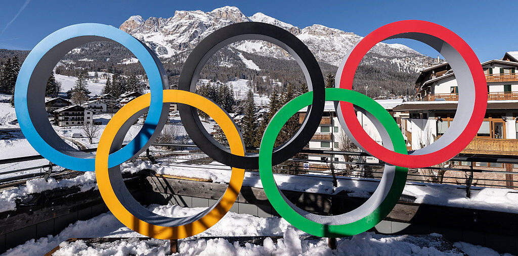 The Winter Olympics Opening Ceremony Rings are set in front of surrounding mountains on January 27, 2026 in Cortina d'Ampezzo, Italy. Cortina will host Sliding, Curling and Women's Alpine events.