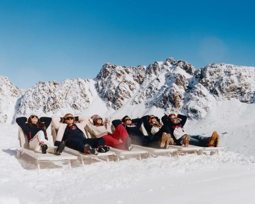 US Ski & Snowboard athletes Colby Stevenson, Rell Harwood, Tess Johnson, Hailey Langland, River Radamus, and Zach Miller pose in J.Crew gear for the retailer's 2026 Olympics collection.