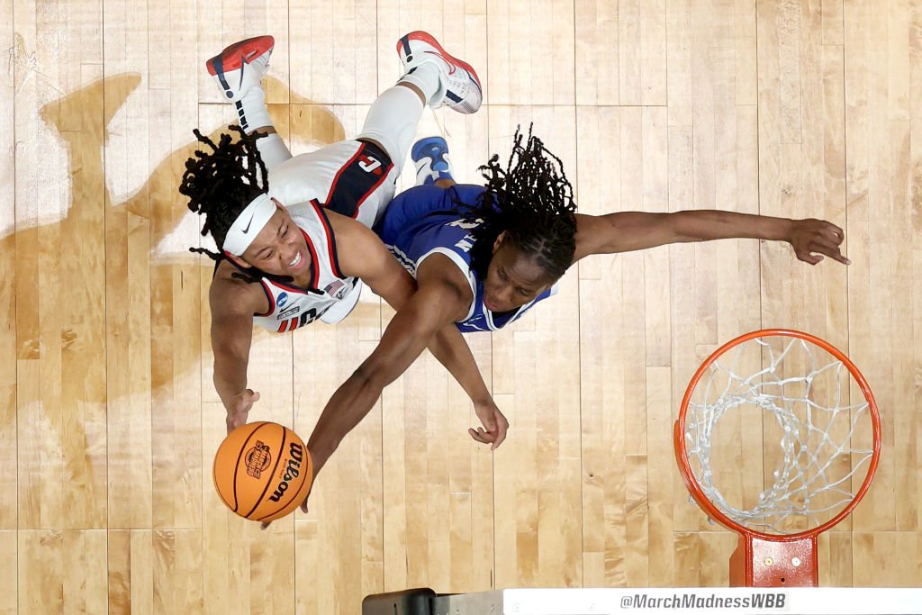 KK Arnold #2 of the UConn Huskies shoots against Jadyn Donovan #4 of the Duke Blue Devils in the Sweet 16 round of the NCAA Women's Basketball Tournament at Moda Center on March 30, 2024 in Portland, Oregon.