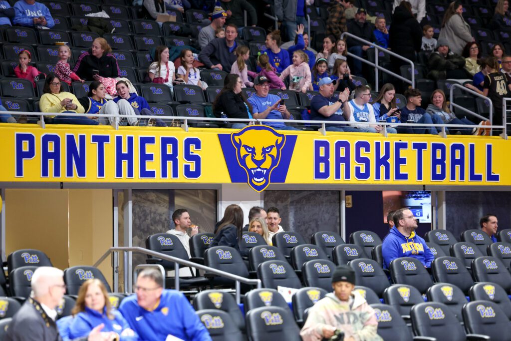 A banner saying "Panthers Basketball" hangs in the stands during a 2025/26 Pitt women's basketball game.