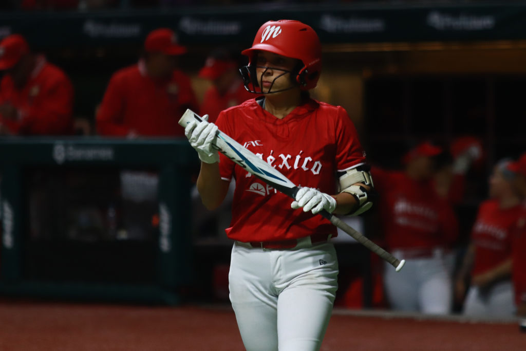 Yamilet Sandoval #14 of Diablos Rojos at the bat against Olmecas de Tabasco before the Mexico cartel violence made the women's softball league cancel games.