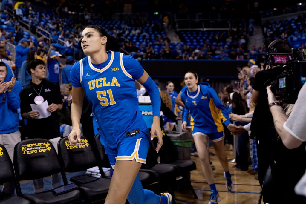 UCLA center Lauren Betts runs onto the court before a 2025/26 NCAA basketball game.