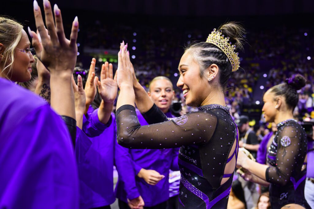 LSU sophomore Kailin Chio high-fives her teammates during a 2026 NCAA gymnastics meet.