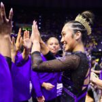 LSU sophomore Kailin Chio high-fives her teammates during a 2026 NCAA gymnastics meet.