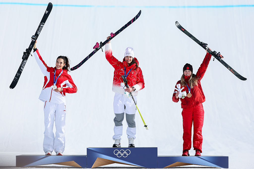 Gold medalist Mathilde Gremaud of Team Switzerland, Silver medalist Ailing Eileen Gu of Team People's Republic of China and Bronze medalist Megan Oldham of Team Canada pose on the podium after winning the Women's Slopestyle Final on day three of the Milano Cortina 2026 Winter Olympic games at Livigno Snow Park on February 9, 2026 in Livigno, Italy.