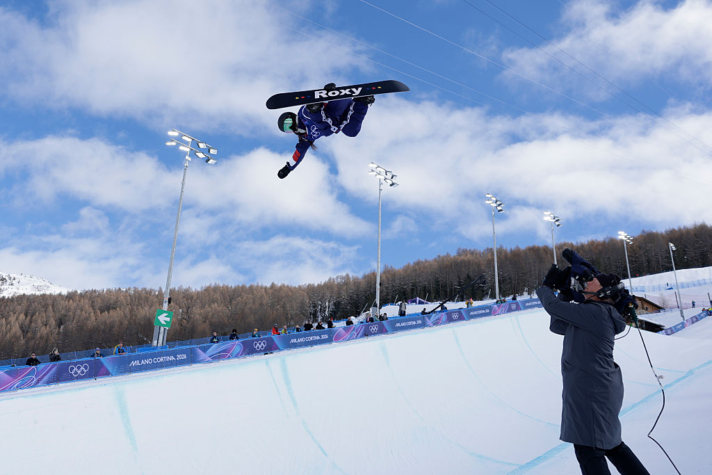 A cameraman films girlfriend of Myles Garrett and 2026 Winter Olympics snowboarder Chloe Kim from the USA during women's halfpipe qualifiers.