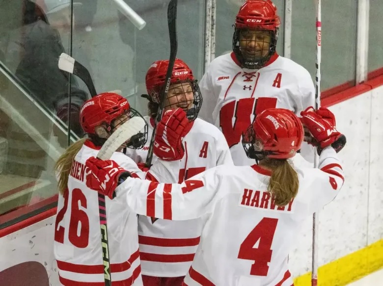 Wisconsin hockey stars Caroline Harvey and Lacey Eden on the ice ahead of the 2026 Frozen Four.