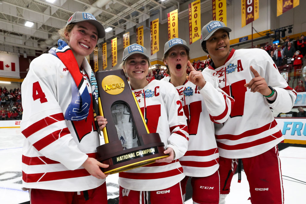 The Wisconsin Badgers celebrate after winning the Division I Women's Ice Hockey Championship game against the Ohio State Buckeyes held at Ridder Arena on March 23, 2025 in Minneapolis, Minnesota.