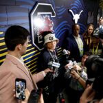 Head Coach Dawn Staley of South Carolina Women's Basketball talks with media during a press conference outside the locker room ahead of the Iran military strikes.