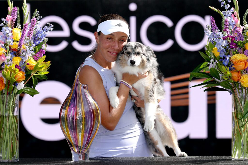 Jessica Pegula of United States poses with the trophy and her dog Maddie after defeating Sofia Kenin of United States during the final of the Credit One Charleston Open at Credit One Stadium on April 06, 2025 in Charleston, South Carolina.