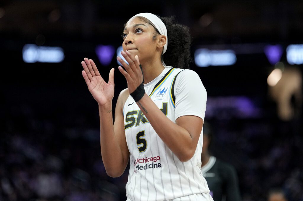 Chicago Sky star Angel Reese claps during a 2025 WNBA game.
