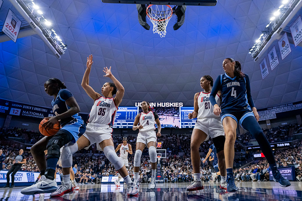 MD Ntambue #3 and Kylee Watson #4 of the Villanova Wildcats are defended by Azzi Fudd #35 and Sarah Strong #21 of the UConn basketball Huskies during the second half of an NCAA women's basketball game at Harry A. Gampel Pavilion on January 15, 2026 in Storrs, Connecticut.