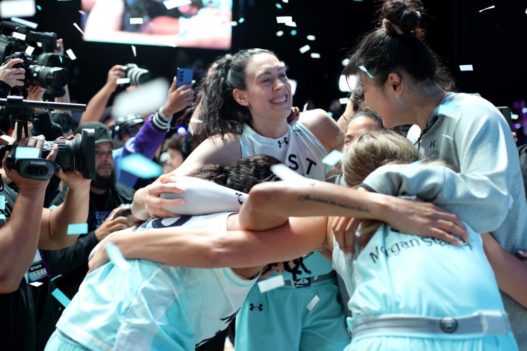 Mist BC's Breanna Stewart, Alanna Smith, Veronica Burton, Li Yueru, and Arike Ogunbowale celebrate winning the 2026 Unrivaled championship.