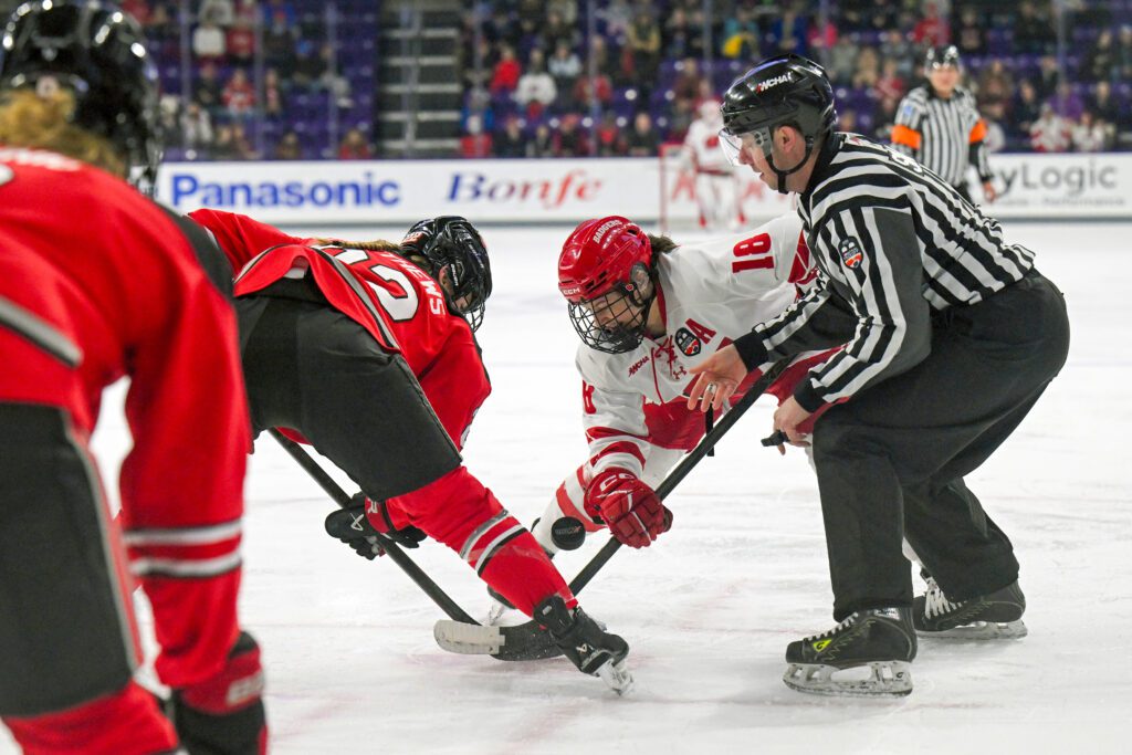 Ohio State forward Sloane Matthews and Wisconsin forward Marianne Picard face-off during the 2026 WCHA women's hockey tournament championship game.