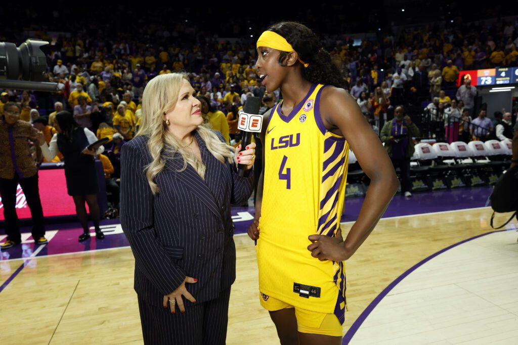 Flau'jae Johnson #4 of the LSU Tigers is interviewed by ESPN reporter Holly Rowe after a game against the Tennessee Lady Volunteers at Pete Maravich Assembly Center on February 26, 2026 in Baton Rouge, Louisiana ahead of the Women's March Madness NCAA basketball tournament Elite 8 during her extended NCAA elibility.