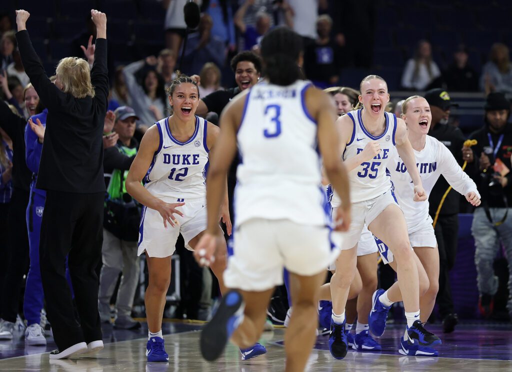 Duke women's basketball players react to their overtime title win at the 2026 ACC tournament.