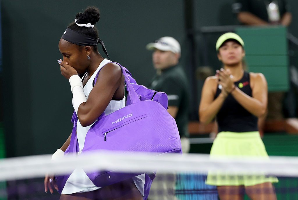 Coco Gauff of the United States walks off court showing her emotion after she has retired with an arm injury against Alexandra Eala of the Phiippines during their third round match of the BNP Paribas Open at Indian Wells Tennis Garden on March 08, 2026 in Indian Wells, California.