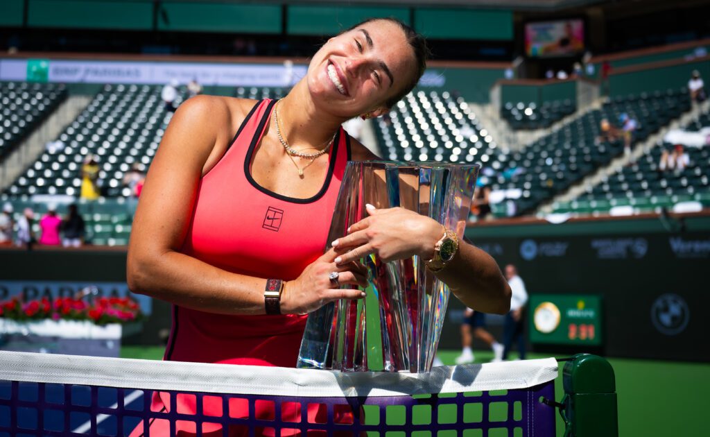 Aryna Sabalenka smiles while posing with her championship trophy after the 2026 BNP Paribas Open at Indian Wells final.