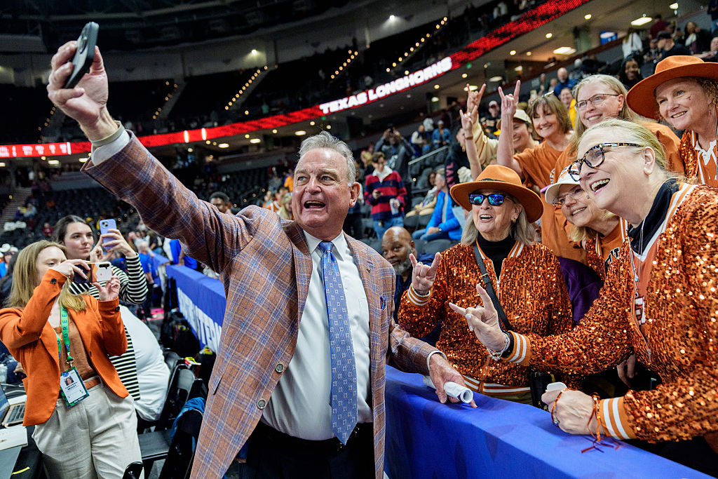 Head coach Vic Schaefer of the Texas Longhorns takes a photo with fans after defeating the South Carolina Gamecocks during the championship game of the SEC Women's Basketball Tournament at Bon Secours Wellness Arena on March 08, 2026 in Greenville, South Carolina.