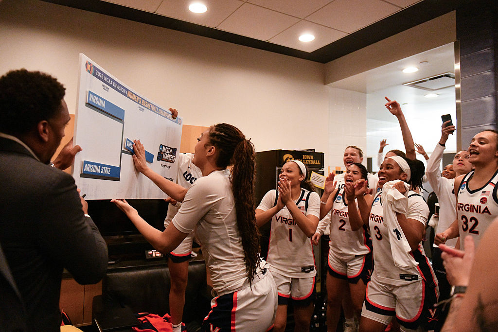 Before its Women's March Madness game with Georgia basketball members of the Virginia Cavaliers women's basketball team celebrate after beating the Arizona State Sun Devils during a First Four game of the 2026 NCAA Women's Basketball Tournament held at Carver-Hawkeye Arena on March 19, 2026 in Iowa City, Iowa.