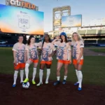 Gotham FC's Savannah McCaskill, Rose Lavelle, Jaedyn Shaw, Lilly Reale, and Jaelin Howell pose in their NWSL kits at Citi Field, home of MLB's New York Mets.
