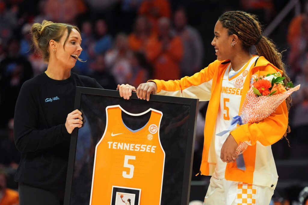 Tennessee’s Kaiya Wynn (5) is recognized by Tennessee basketball coach Kim Caldwell during senior day celebration before the start of the NCAA college basketball game against Vanderbilt on Mar. 1, 2026, in Knoxville, Tennessee.
