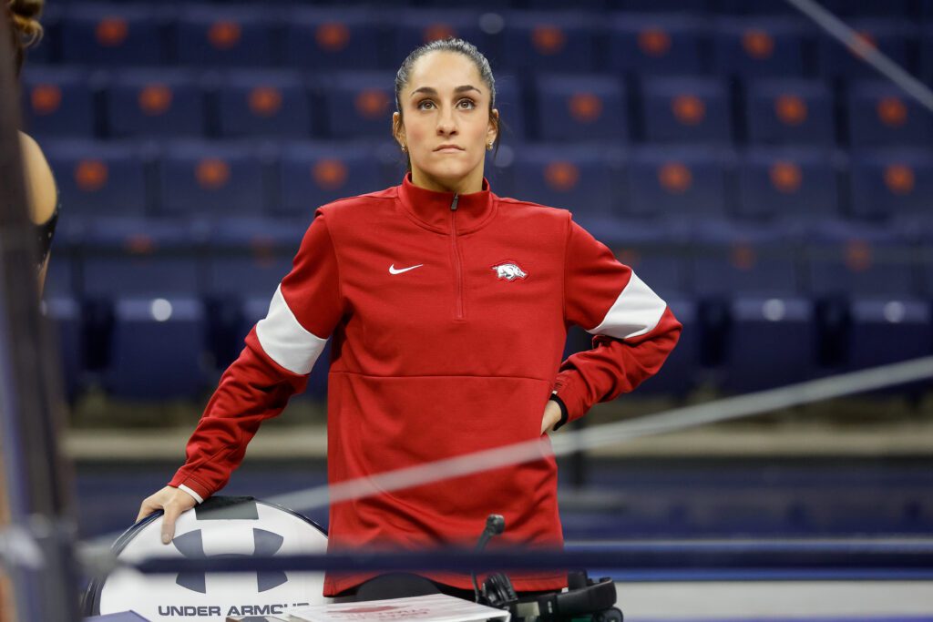 Arkansas gymnastics coach and Olympic gold medalist Jordyn Wieber watches warm ups prior to a meet against Auburrn at Neville Arena on January 20, 2023 in Auburn, Alabama.