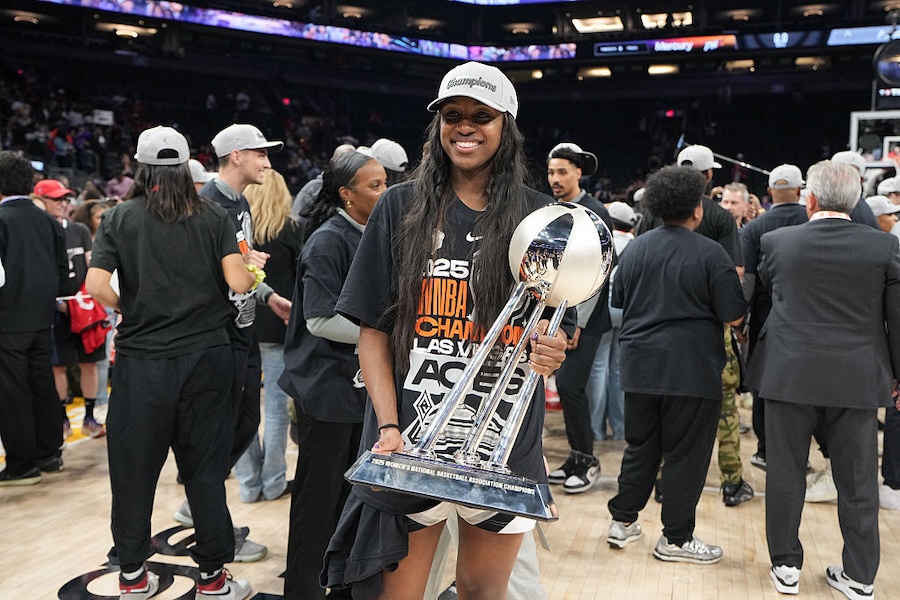 Jackie Young #0 of the Las Vegas Aces poses for a photo with the 2025 WNBA Championship trophy after the game against the Phoenix Mercury on October 10, 2025 at PHX Arena in Phoenix, Arizona.