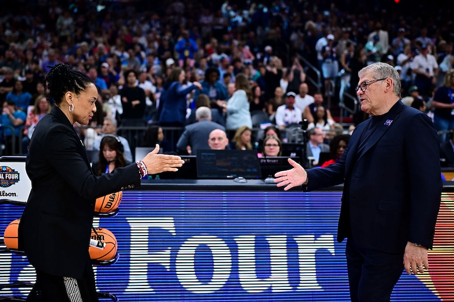 Dawn Staley of the South Carolina Gamecocks walks to shake hands with Geno Auriemma of the UConn Huskies prior to a NCAA Women's Final Four semifinal game at Mortgage Matchup Center on April 3, 2026 in Phoenix, Arizona.