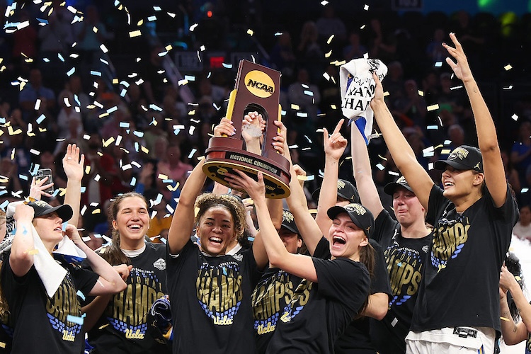 Kiki Rice #1 and Gabriela Jaquez #11 of the UCLA Bruins celebrate with the trophy after the victory against the South Carolina Gamecocks in the National Championship of the NCAA Women's Basketball Tournament at Mortgage Matchup Center on April 05, 2026 in Phoenix, Arizona.