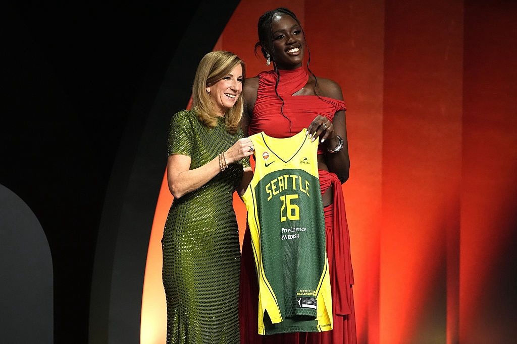 Awa Fam Thiam (R) of Spain poses with WNBA Commissioner Cathy Engelbert (L) after being selected with the 3rd pick in the first round by the Seattle Storm during the 2026 WNBA Draft at The Shed on April 13, 2026 in New York City.