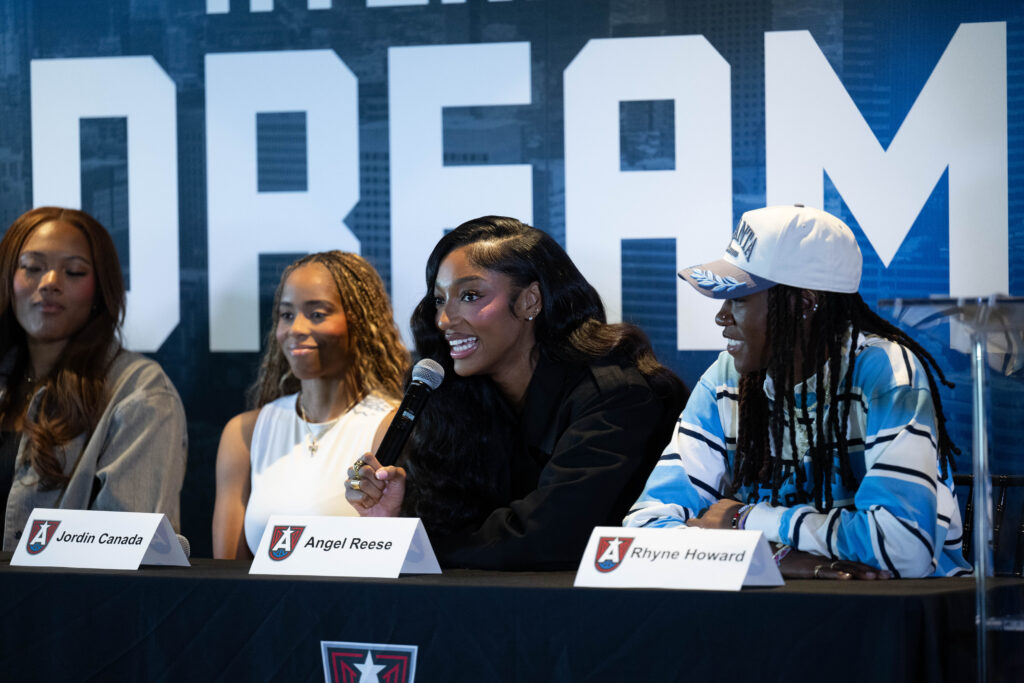 Angel Reese of the Atlanta Dream speaks to the media during her introductory press conference on April 17, 2026 at the Summit of 8West in Atlanta, Georgia.
